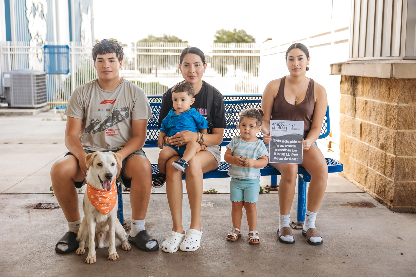 A family and their newly adopted dog at Palm Valley Animal Society
