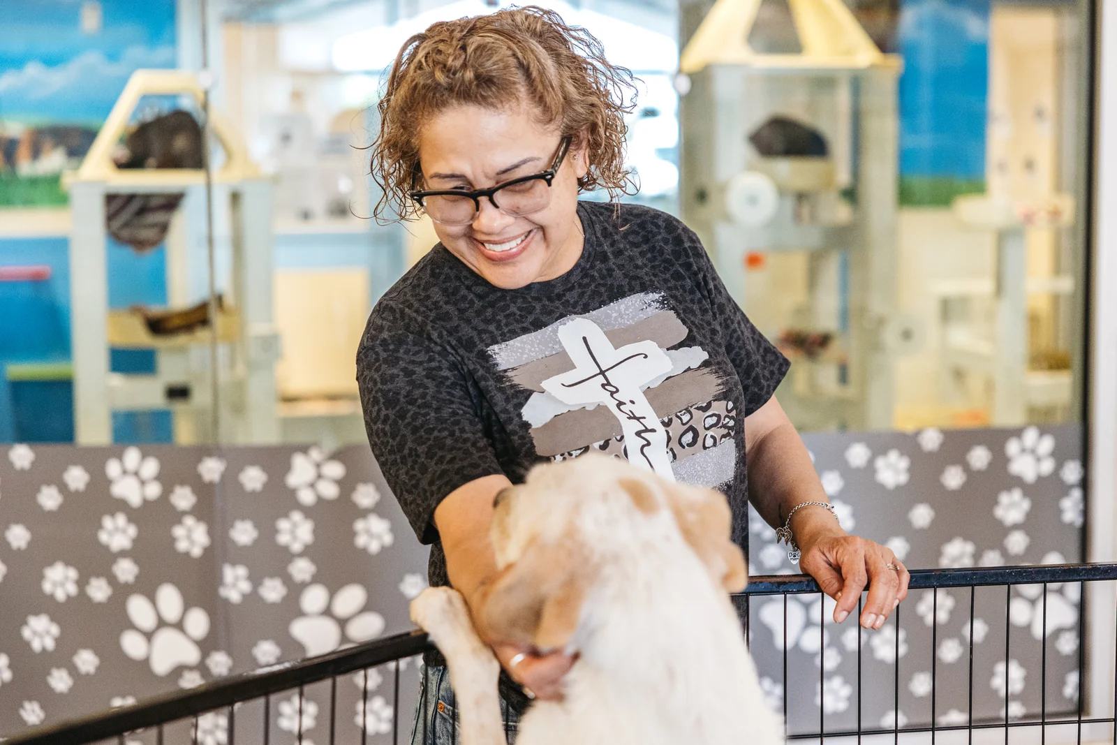 A PVAS team member holding a dog ready for a loving home